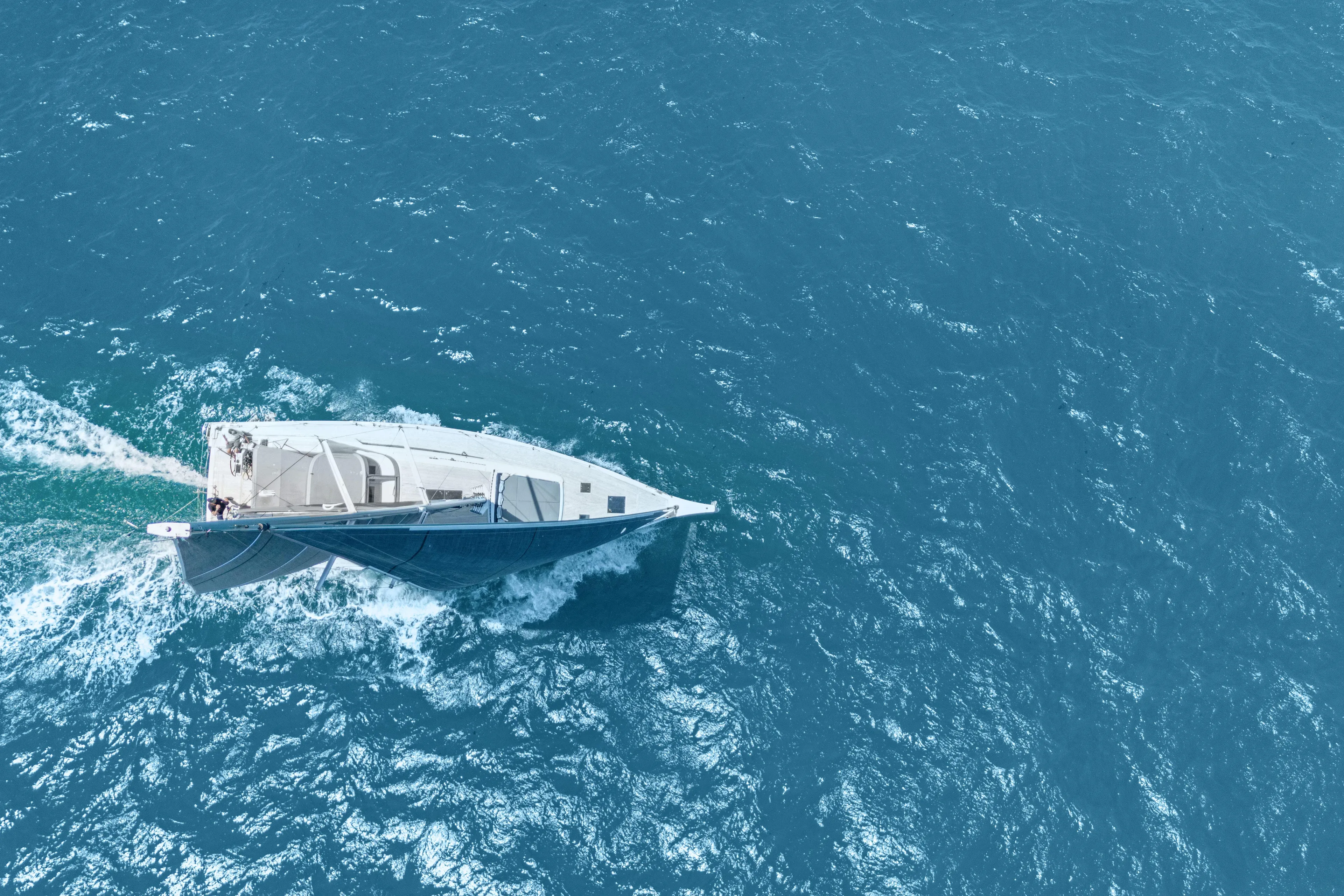 Estela Yacht Photos Pics Aerial view of 2017 Grand Soleil 52 Long Cruise sailing on open sea.