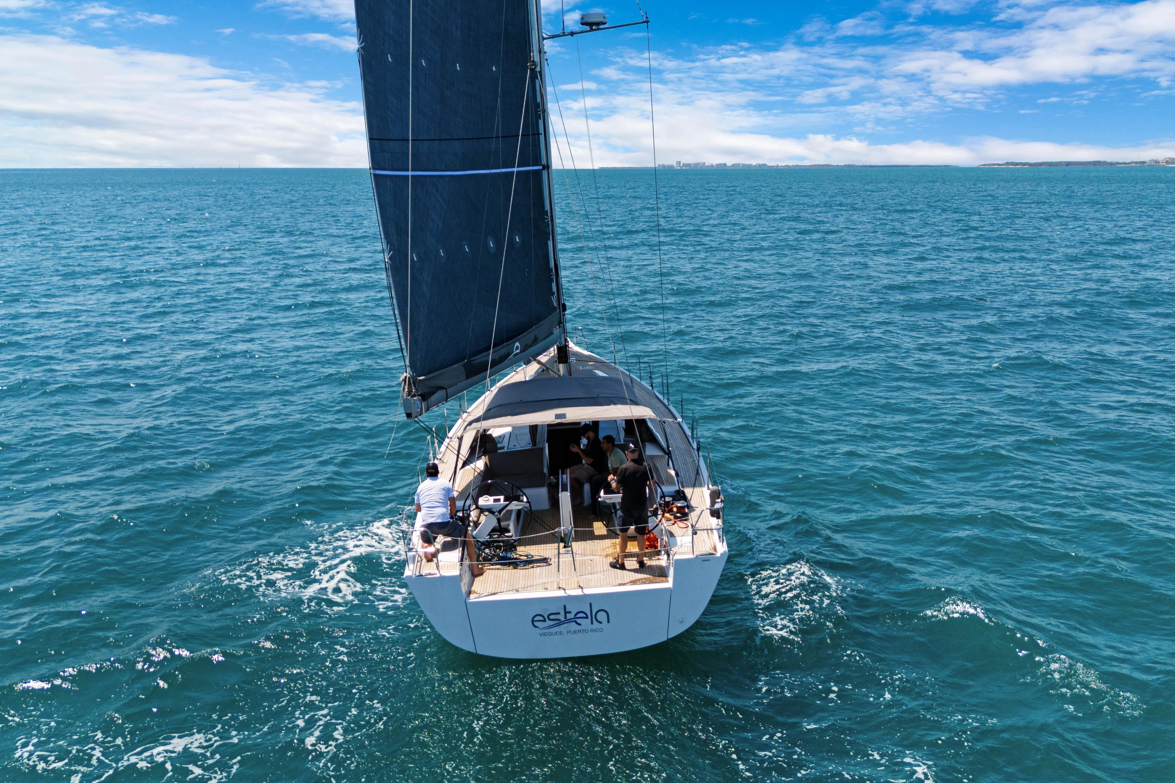 Estela Yacht Photos Pics Grand Soleil 52 Long Cruise 2017 sailing on open sea under clear blue sky.