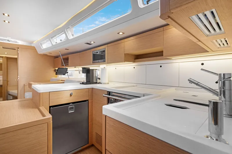 Estela Yacht Photos Pics Luxurious kitchen interior of 2017 Grand Soleil 52 Long Cruise yacht, featuring modern appliances.