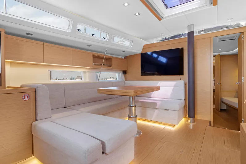 Estela Yacht Photos Pics Luxurious interior of 2017 Grand Soleil 52 Long Cruise yacht with modern seating and wood finishes.