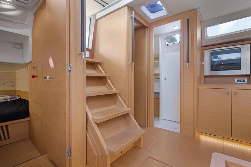 Estela Yacht Photos Pics Interior of 2017 Grand Soleil 52 Long Cruise yacht with wooden finishes and modern amenities.