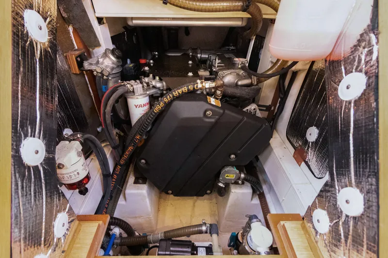 Estela Yacht Photos Pics Engine compartment of a 2017 Grand Soleil 52 Long Cruise yacht, showcasing mechanical components.