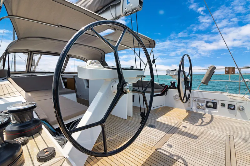 Estela Yacht Photos Pics Grand Soleil 52 Long Cruise 2017 yacht cockpit with dual steering wheels and teak deck.