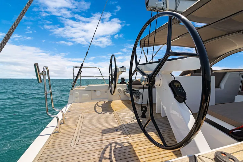 Estela Yacht Photos Pics Grand Soleil 52 Long Cruise 2017 yacht deck with dual steering wheels, sailing on open sea.