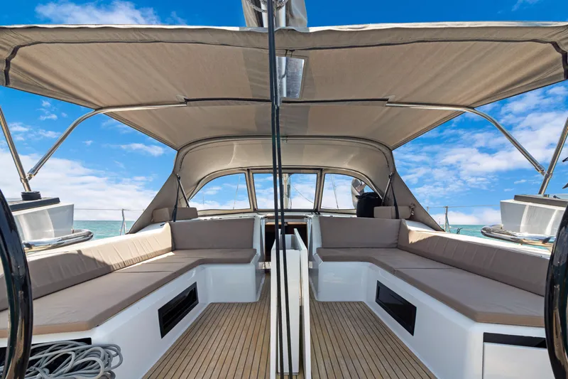 Estela Yacht Photos Pics Grand Soleil 52 Long Cruise 2017 yacht interior with spacious seating and canopy under blue sky.