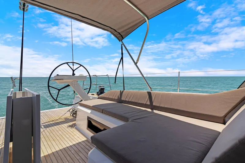 Estela Yacht Photos Pics 2017 Grand Soleil 52 Long Cruise yacht deck with helm, seating, and ocean view.