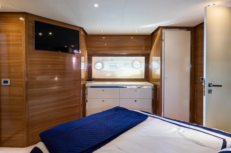 Balliamo Yacht Photos Pics Luxurious cabin interior of 2011 Uniesse 55S yacht with wood paneling and modern amenities.