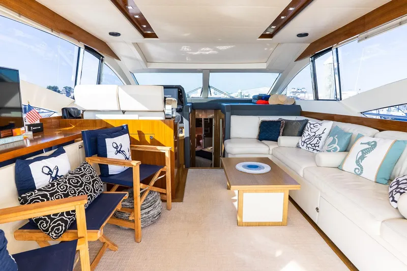 Balliamo Yacht Photos Pics Luxurious interior of 2011 Uniesse 55S yacht with elegant seating and nautical decor.