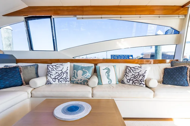 Balliamo Yacht Photos Pics Luxurious interior of 2011 Uniesse 55S yacht with nautical-themed cushions.
