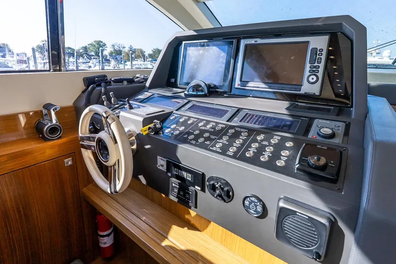 Balliamo Yacht Photos Pics Cockpit of 2011 Uniesse 55S yacht with advanced navigation controls and dual screens.