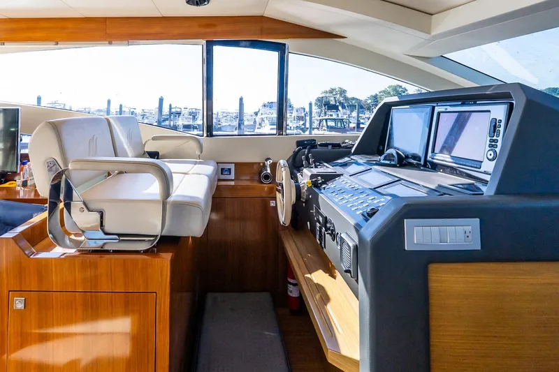 Balliamo Yacht Photos Pics Luxurious helm of 2011 Uniesse 55S yacht with modern navigation equipment.