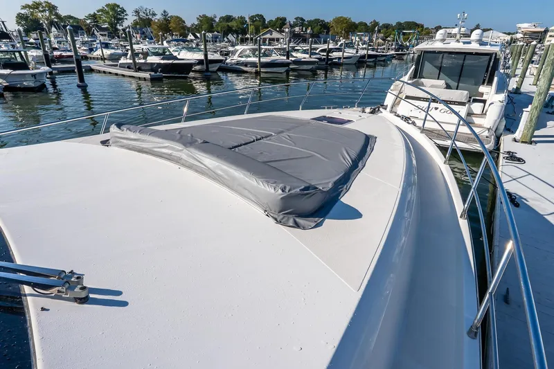 Balliamo Yacht Photos Pics 2011 Uniesse 55S yacht docked at marina, showcasing sleek deck design.