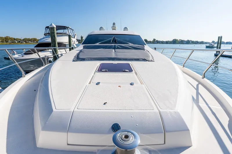 Balliamo Yacht Photos Pics 2011 Uniesse 55S yacht docked, showcasing sleek design and spacious deck.