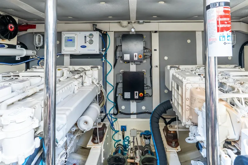 Balliamo Yacht Photos Pics Engine room of 2011 Uniesse 55S yacht, showcasing dual engines and control systems.