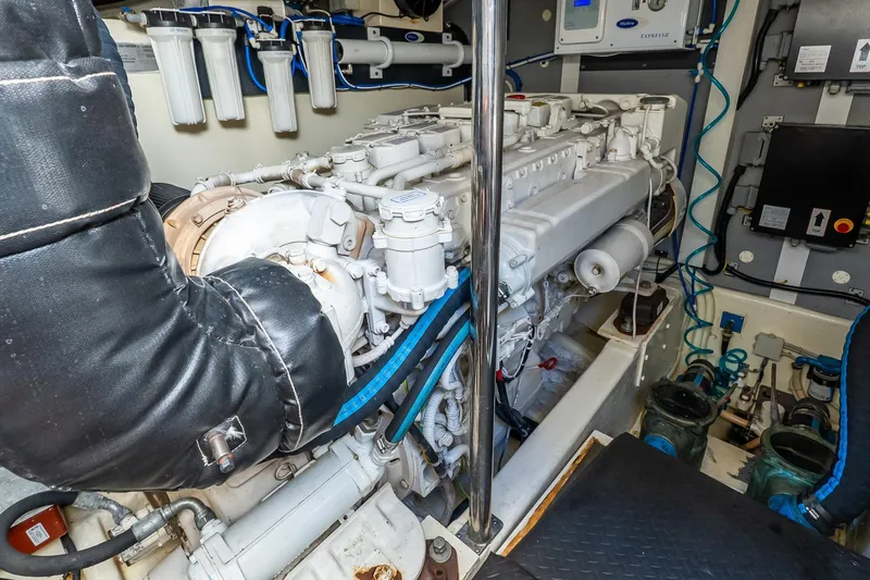 Balliamo Yacht Photos Pics Engine room of 2011 Uniesse 55S yacht, showcasing mechanical components and systems.