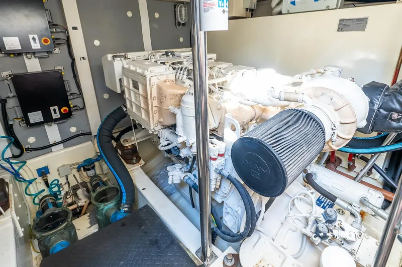 Balliamo Yacht Photos Pics Engine room of 2011 Uniesse 55S yacht, showcasing mechanical components and systems.