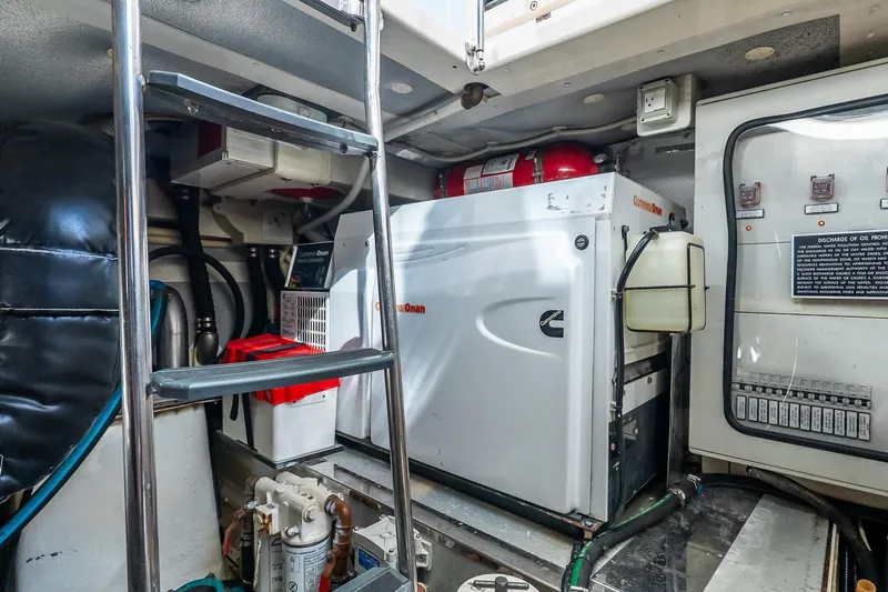 Balliamo Yacht Photos Pics Engine room of 2011 Uniesse 55S yacht with Cummins Onan generator and control panel.