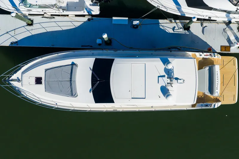 Balliamo Yacht Photos Pics Aerial view of 2011 Uniesse 55S yacht docked at a marina.