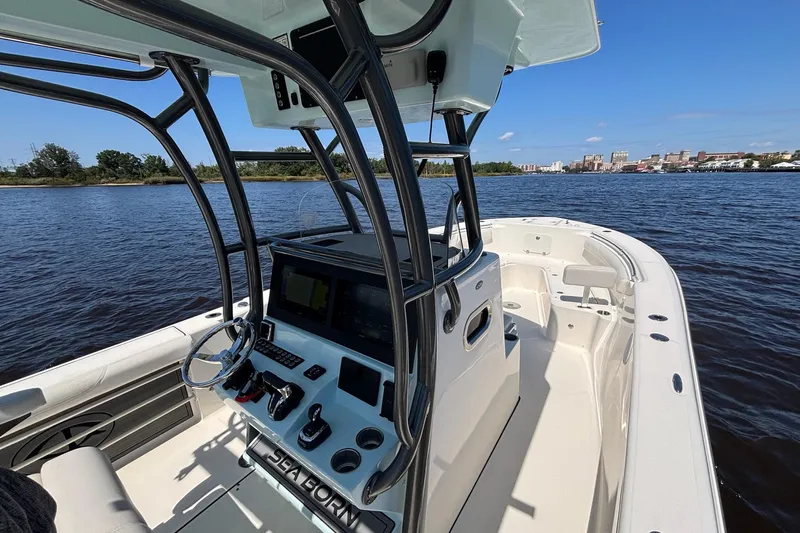 Tagged Yacht Photos Pics 2023 Sea Born LX26 Center Console boat on calm water, showcasing sleek design and modern features.