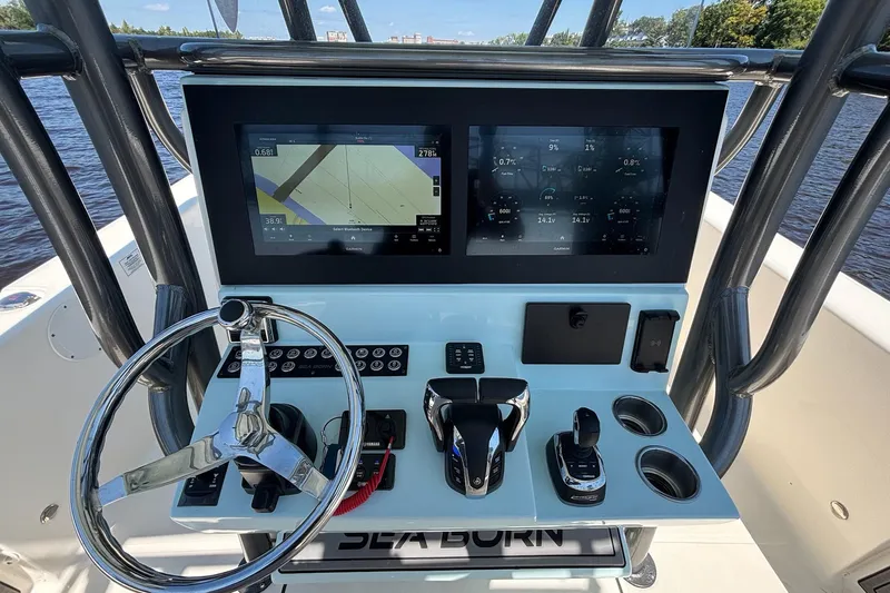 Tagged Yacht Photos Pics 2023 Sea Born LX26 Center Console dashboard with dual screens and steering wheel.