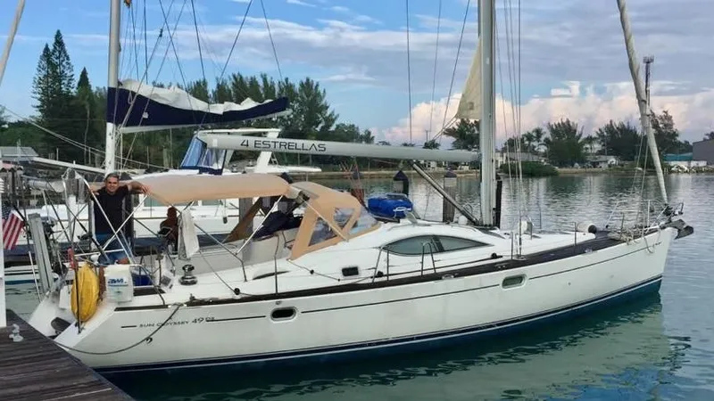 4 Estrellas Yacht Photos Pics Proud owner and his Jeanneau 49 DS