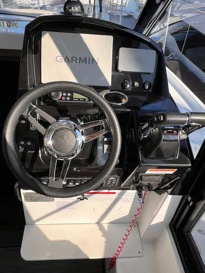  Yacht Photos Pics 2020 Jeanneau NC 895 helm with Garmin navigation system and steering wheel.
