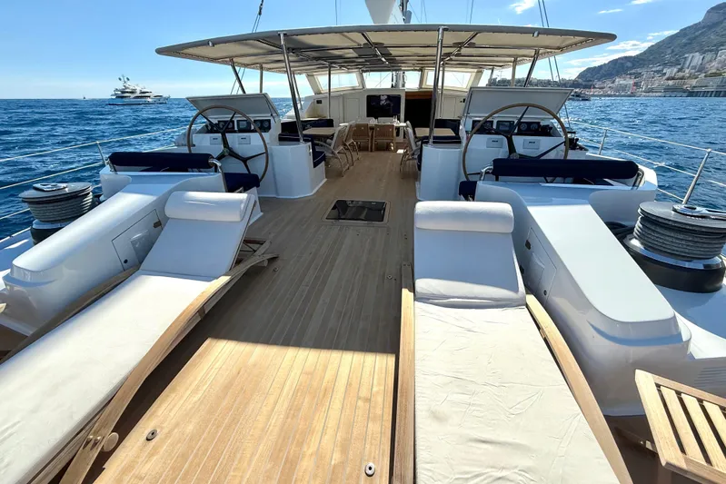  Yacht Photos Pics Luxurious 2004 Dereli S/Y 39 m yacht deck with sun loungers and steering wheels.