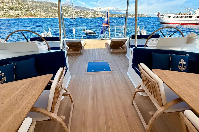  Yacht Photos Pics Luxurious 2004 Dereli S/Y 39 m yacht deck with seating, tables, and ocean view.