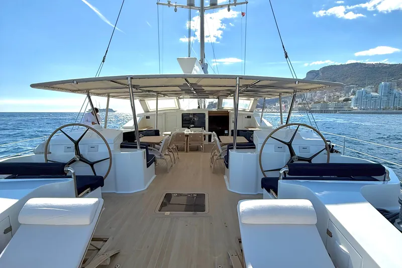  Yacht Photos Pics Luxurious 2004 Dereli S/Y 39 m yacht deck with dual steering wheels, ocean view.