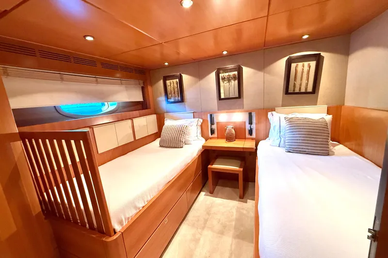  Yacht Photos Pics Luxurious twin cabin on 2004 Dereli S/Y 39 m yacht, featuring elegant wood paneling.