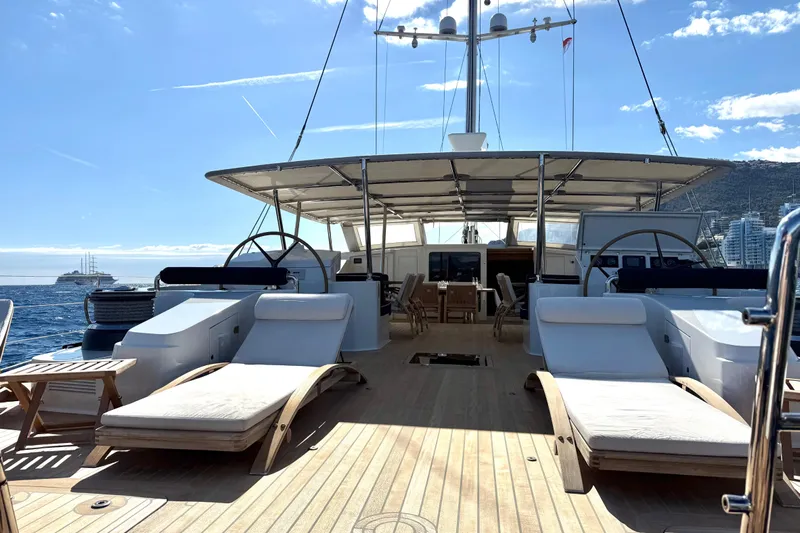  Yacht Photos Pics Luxurious 2004 Dereli S/Y 39 m yacht deck with sun loungers and ocean view.