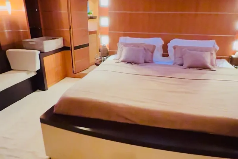  Yacht Photos Pics Luxurious bedroom interior on 2004 Dereli S/Y 39 m yacht, featuring elegant wood paneling.
