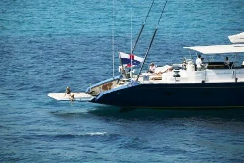  Yacht Photos Pics Luxurious 2004 Dereli Yachts S/Y 42 m sailing in clear blue waters.