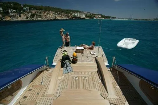 Yacht Photos Pics Luxurious 2004 Dereli Yachts S/Y 42 m, anchored with people enjoying the sun.