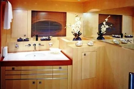  Yacht Photos Pics Luxurious yacht bathroom with modern design, featuring wooden accents and elegant decor, 2004 Dereli Yachts.