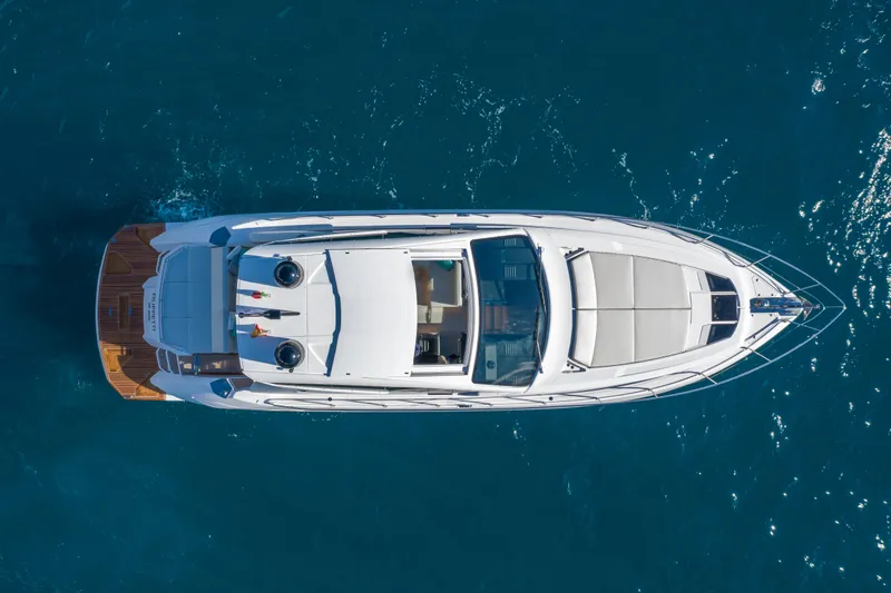 Filippetti S55 Yacht Photos Pics Aerial view of 2025 Filippetti Sport 55 yacht on blue ocean water.