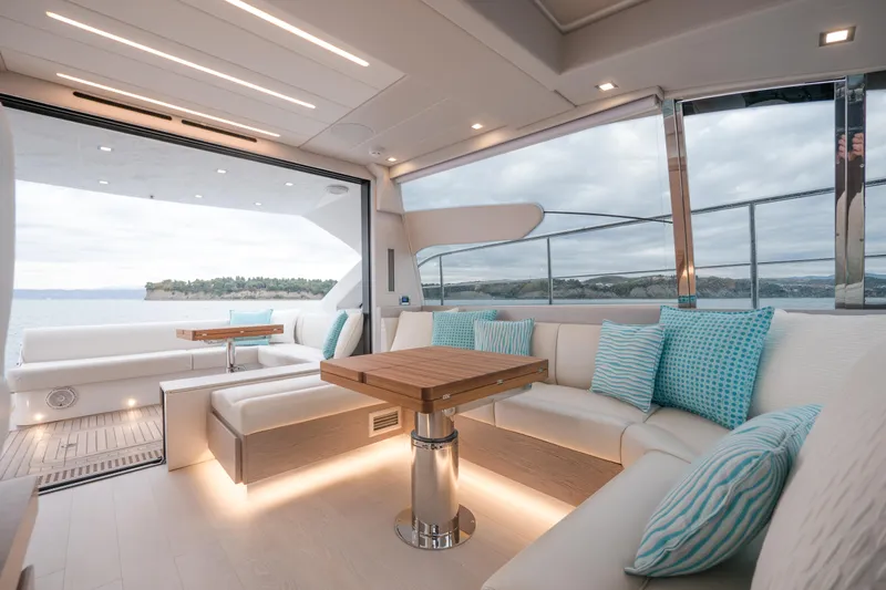Filippetti S55 Yacht Photos Pics Luxurious interior of 2025 Filippetti Sport 55 yacht with elegant seating and scenic ocean view.