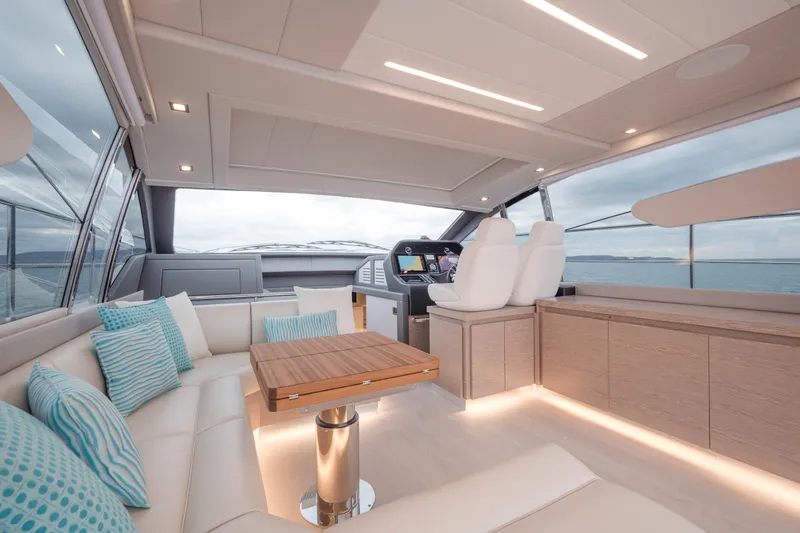 Filippetti S55 Yacht Photos Pics Luxurious interior of 2025 Filippetti Sport 55 yacht with modern seating and ocean view.