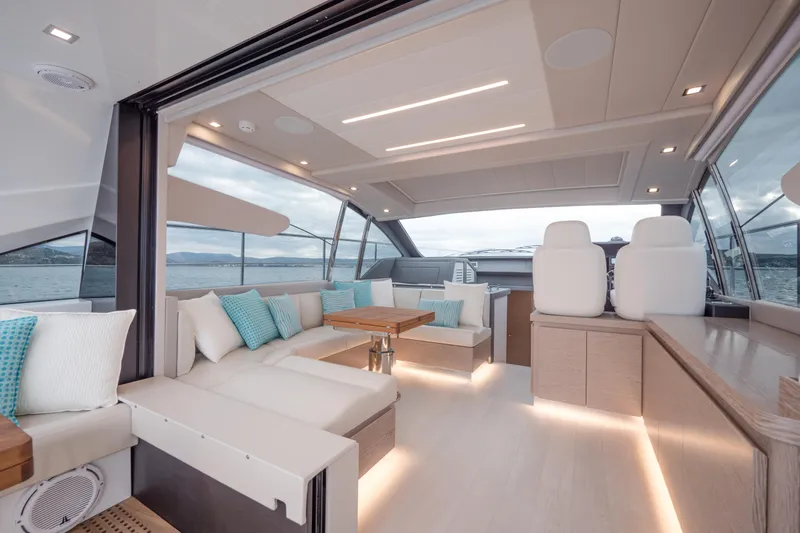Filippetti S55 Yacht Photos Pics Luxurious interior of 2025 Filippetti Sport 55 yacht with modern seating and ocean view.