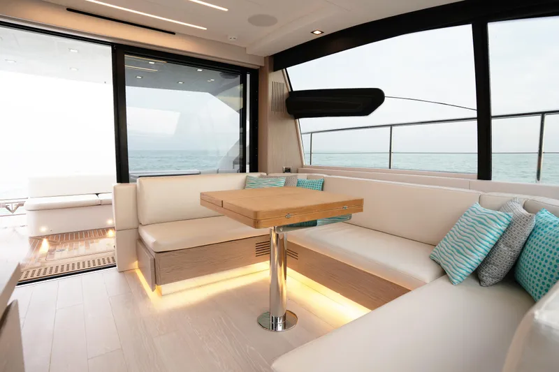 Filippetti S55 Yacht Photos Pics Luxurious interior of 2025 Filippetti Sport 55 yacht with elegant seating and ocean view.