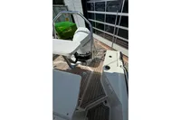 Nimbus C8 2021 boat deck with Mercury engine and wooden flooring.