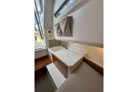 Interior of 2021 Nimbus C8 boat featuring a compact sink and storage area.