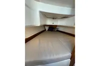 Cozy cabin interior of 2021 Nimbus C8 boat with comfortable bedding.