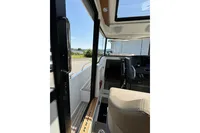 Interior view of 2021 Nimbus C8 boat, showcasing helm and seating area.