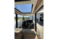 Interior view of 2021 Nimbus C8 boat with modern steering and sunroof.