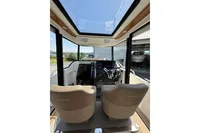 Interior view of 2021 Nimbus C8 boat cockpit with modern steering and seating.