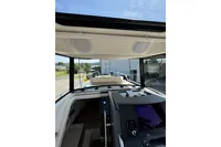 Interior view of 2021 Nimbus C8 boat cockpit with modern controls and navigation system.
