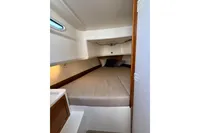 Cozy cabin interior of 2021 Nimbus C8 boat with comfortable bedding.