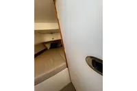 Cozy cabin interior of 2021 Nimbus C8 boat with comfortable bedding.