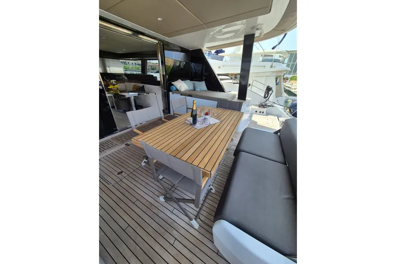 Alemys Yacht Photos Pics Luxurious Sunreef 50 yacht deck with elegant dining area, 2023 model.
